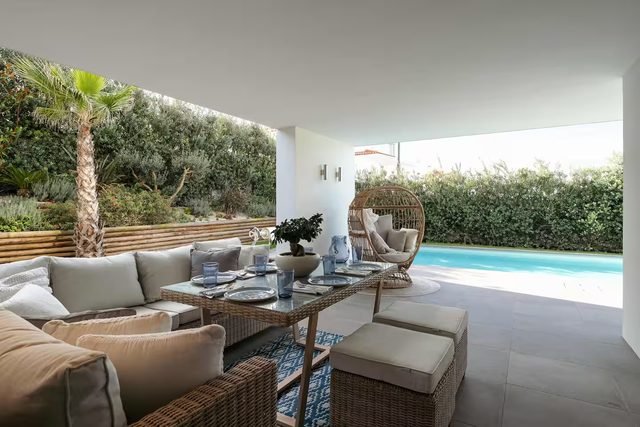Covered outdoor lounge by the pool