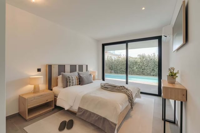 Bedroom with a view of the pool