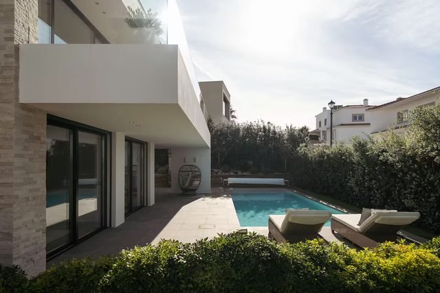 Villa and pool seen from the side