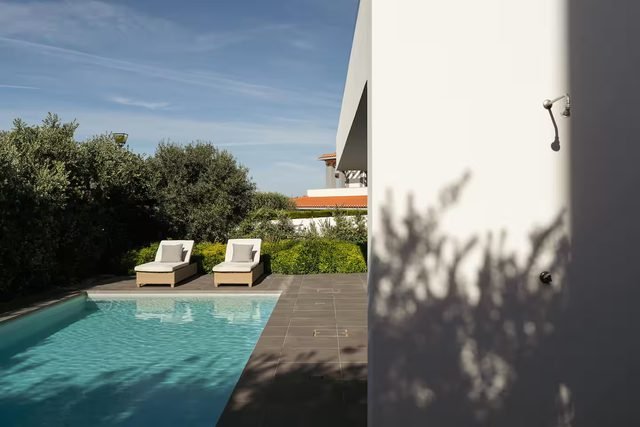 Pool with sun loungers